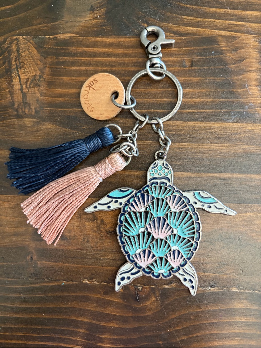Sakroots Turtle Tassel Keychain with Navy & Blush Accents and matching backpack